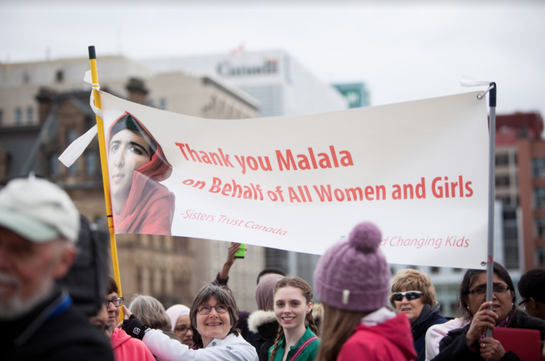 Dozens of fans gather on Parliament Hill in Ottawa on Wed. April 12, 2017 to show their support for Nobel laureate Malala Yousafzai's honorary Canadian citizenship. Photo by Alex Tétreault